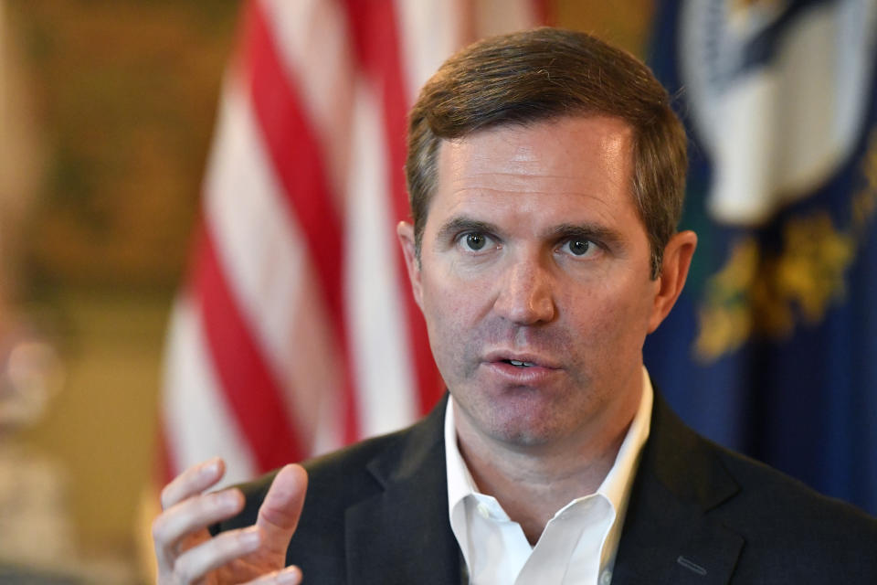 Kentucky Governor Andy Beshear responds to a question during an interview in Frankfort, Ky., Tuesday, Dec. 19, 2023. (AP Photo/Timothy D. Easley)