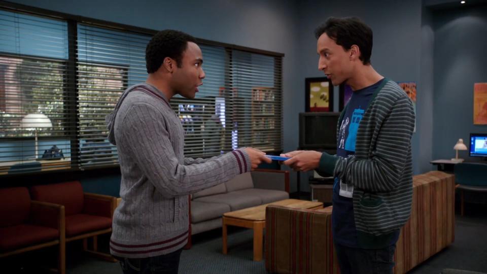 Troy and Abed holding a DVD case of "Freaky Friday" in "Community"