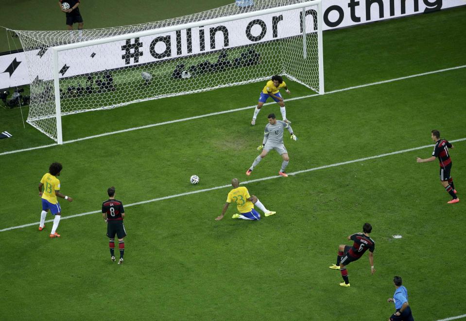 Germany's Sami Khedira scores a goal during their 2014 World Cup semi-finals against Brazil at the Mineirao stadium in Belo Horizonte July 8, 2014. REUTERS/Felipe Dana/Pool