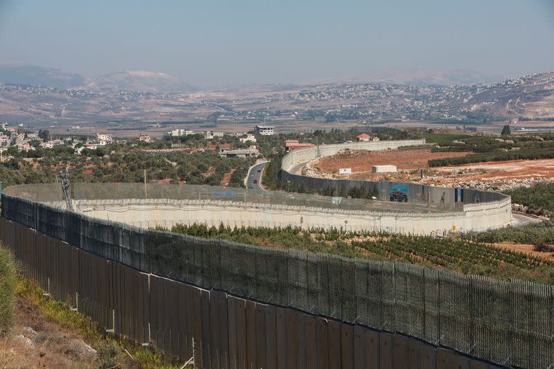 A view shows the border wall between Lebanon and Israel as pictured from Kfar Kila village