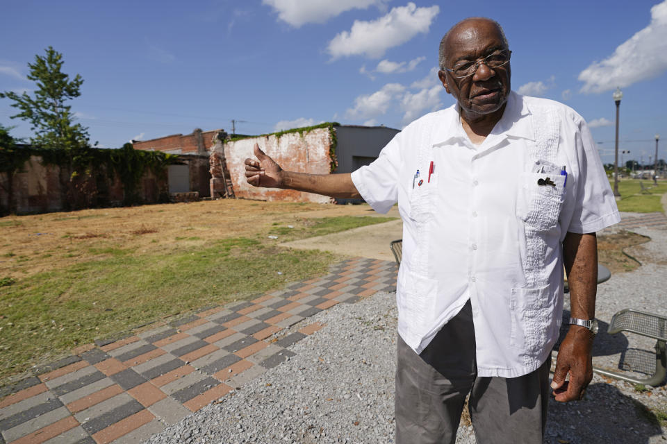 State Sen. David Jordan, D-Greenwood, gestures, July 14, 2021, towards a possible site for a memorial statue in Rail Spike Park, in Greenwood, Miss., recognizing Emmett Till, a 14-year-old African American teen who was beaten and killed in 1955, after he was accused of whistling at a white woman at her family's store. For more than a century, one of Mississippi’s largest and most elaborate Confederate monuments has looked out over the lawn at the courthouse in the center of Greenwood. It's a Black-majority city with a rich civil rights history. Officials voted last year to remove the statue, but little progress has been made to that end. (AP Photo/Rogelio V. Solis)