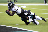 Baltimore Ravens' Gus Edwards (35) scores a touchdown as Philadelphia Eagles' Shaun Bradley (54) during the first half of an NFL football game, Sunday, Oct. 18, 2020, in Philadelphia. (AP Photo/Derik Hamilton)