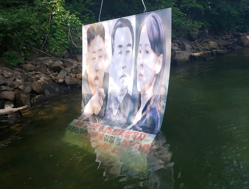 A balloon containing leaflets denouncing North Korean leader Kim Jong Un, released by a North Korean defector group on June 22, is seen at a hill in Hongcheon