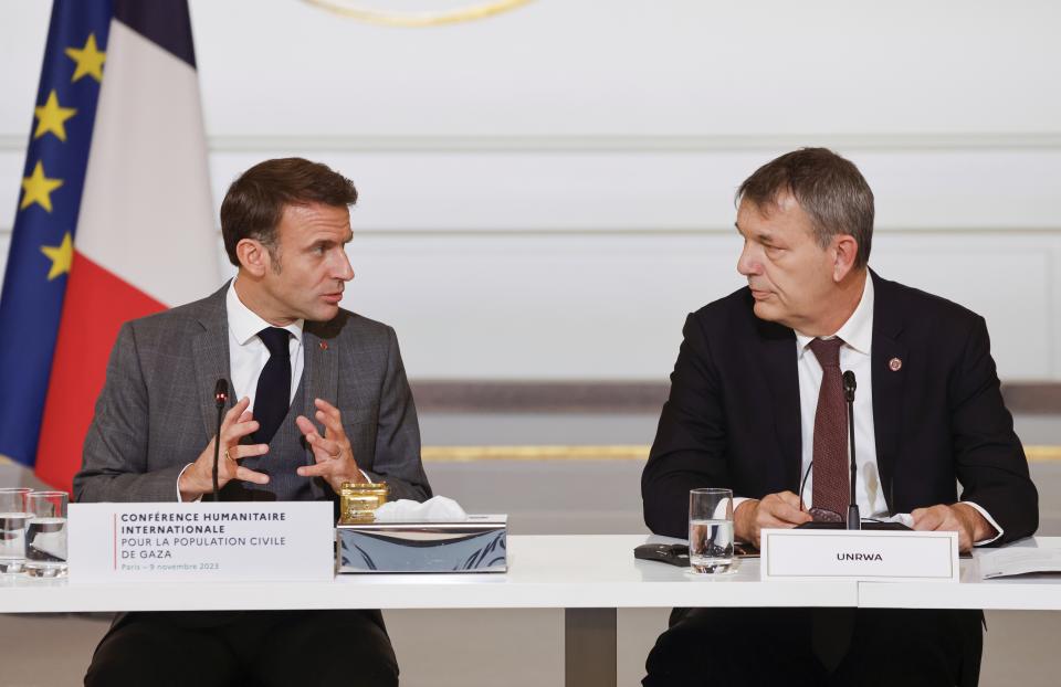 French President Emmanuel Macron, left, speaks to Commissioner general of UNRWA Philippe Lazzarini during a meeting at the Elysee Palace, in Paris, Thursday, Nov. 9, 2023. Macron has opened a Gaza aid conference with an appeal for Israel to protect civilians, saying that "all lives have equal worth" and that fighting terrorism "can never be carried out without rules." (Ludovic Marin, Pool via AP)