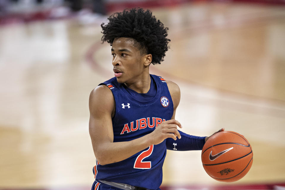 Sharife Cooper #2 of the Auburn Tigers runs the offense during a game against the Arkansas Razorbacks at Bud Walton Arena on January 20, 2021 in Fayetteville, Arkansas. The Razorbacks defeated the Tigers 75-73.  (Photo by Wesley Hitt/Getty Images)