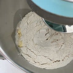 Ingredients for bread in a mixing bowl