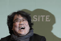 Bong Joon-ho, director of Oscar-winning “Parasite,” laughs during a press conference in Seoul, South Korea, Wednesday, Feb. 19, 2020. Bong said Wednesday “the biggest pleasure and the most significant meaning” that the film has brought to him was its success in many countries though the audiences might feel uncomfortable with his explicit description of a bitter wealth disparity in modern society. (AP Photo/Ahn Young-joon)