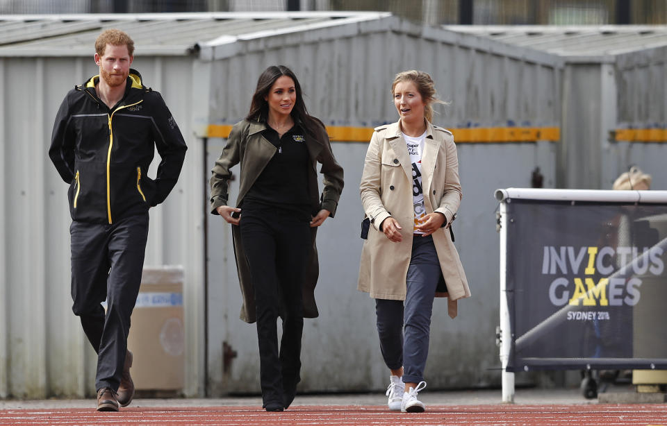 Prince Harry and Meghan Markle wore matching polo shirts. (Photo: Frank Augstein/AP)