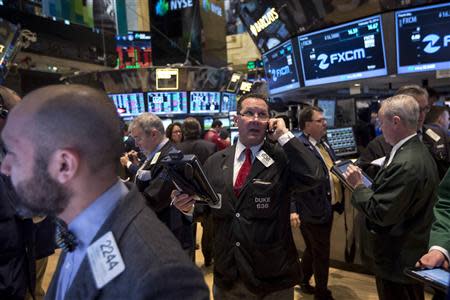 Traders on the floor of the New York Stock Exchange February 18, 2014. REUTERS/Brendan McDermid