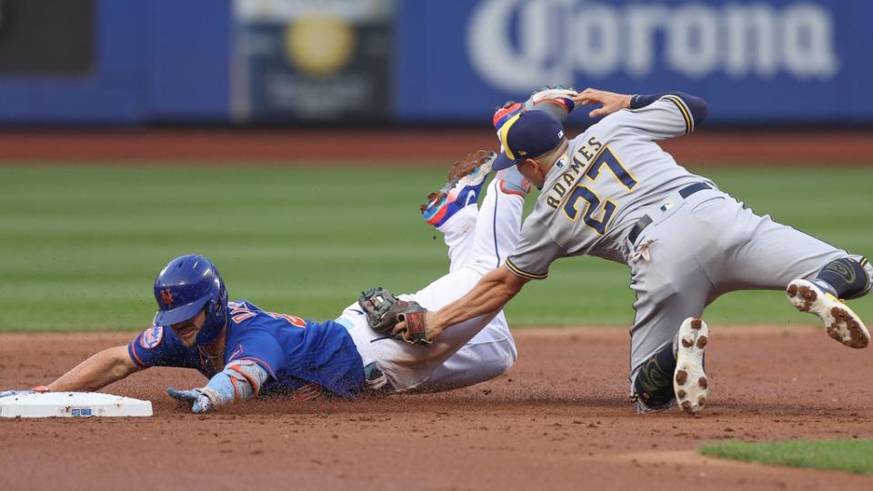 Jun 29, 2023; New York City, New York, USA; New York Mets first baseman Pete Alonso (20) is tagged out by Milwaukee Brewers shortstop Willy Adames (27) attempting to stretch a single during the second inning at Citi Field.