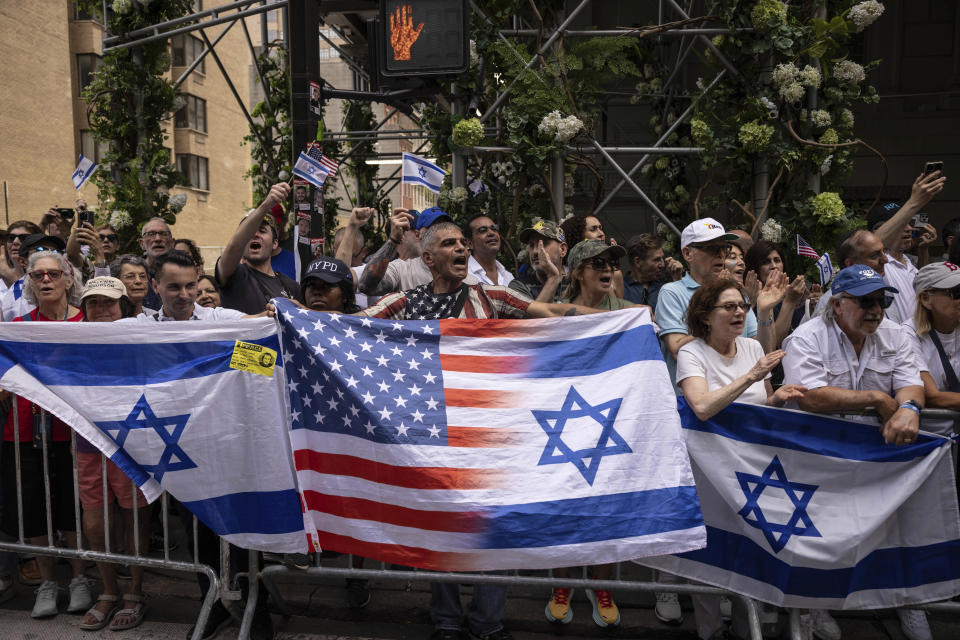 People holding Israeli flags gather for the annual Israel Day Parade on Fifth Avenue on Sunday, June 2, 2024, in New York. (AP Photo/Yuki Iwamura)