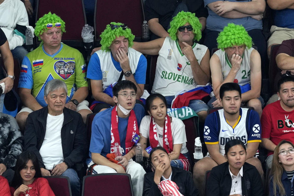 Fans watch during the second half of a Basketball World Cup quarterfinal game between Slovenia and Canada in Manila, Philippines, Wednesday, Sept. 6, 2023. (AP Photo/Aaron Favila)