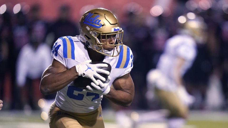 UCLA running back Zach Charbonnet carries the ball during a loss to Utah on Oct. 30.