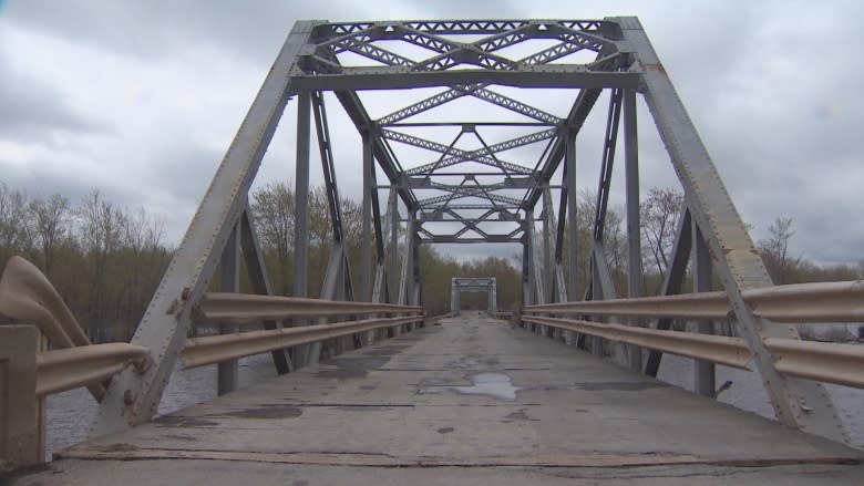 Flood-bashed bridge gives residents option of walking or taking very long detour