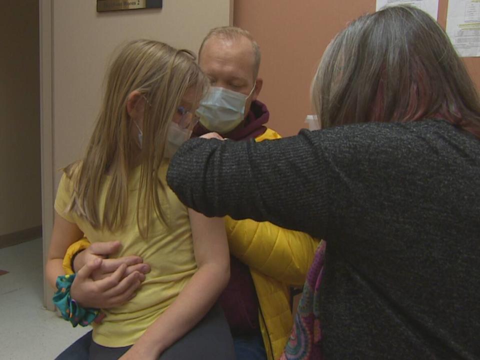 Dr. Janice Fitzgerald administers a COVID-19 vaccine to Ellie Mahoney on Thursday. (Mark Quinn/CBC - image credit)