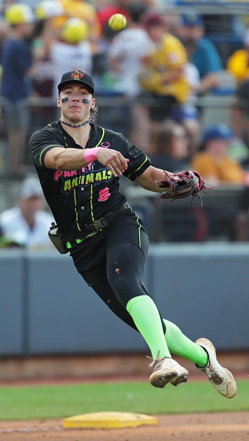 Party Animals third baseman Bryson Bloomer makes a throw to first during the Savannah Bananas' World Tour at Canal Park, Monday, July 3, 2023, in Akron, Ohio.