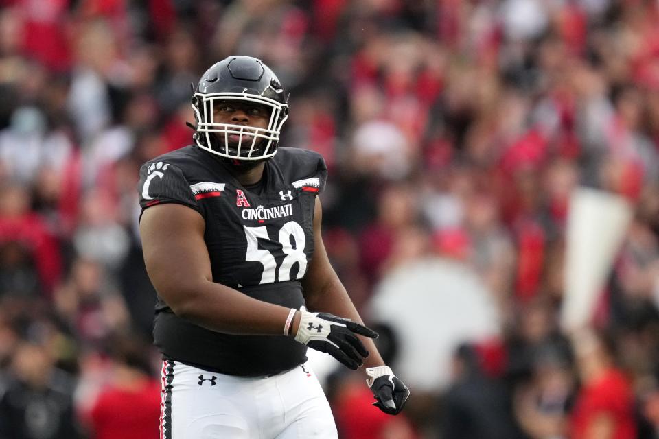 Cincinnati Bearcats defensive lineman Dontay Corleone (58) looks up at the scoreboard in the first quarter during a college football game against the Navy Midshipmen, Saturday, Nov. 5, 2022, at Nippert Stadium in Cincinnati. 