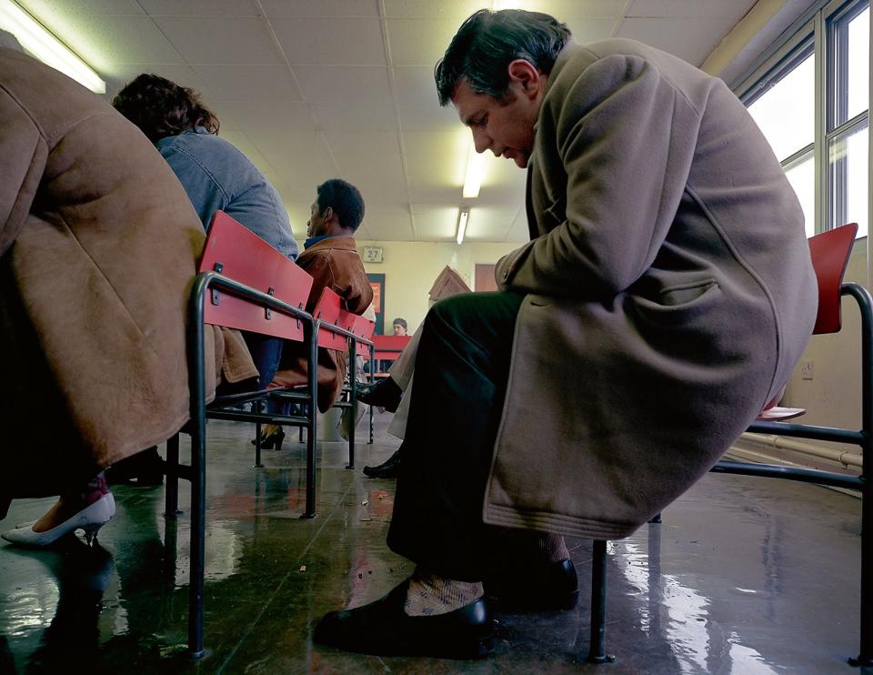 Crouched Man, DHSS Waiting Room, Bristol, 1984Paul Graham/Mack