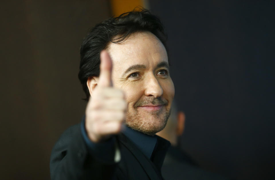 Actor John Cusack poses during a photo-call to promote the movie 