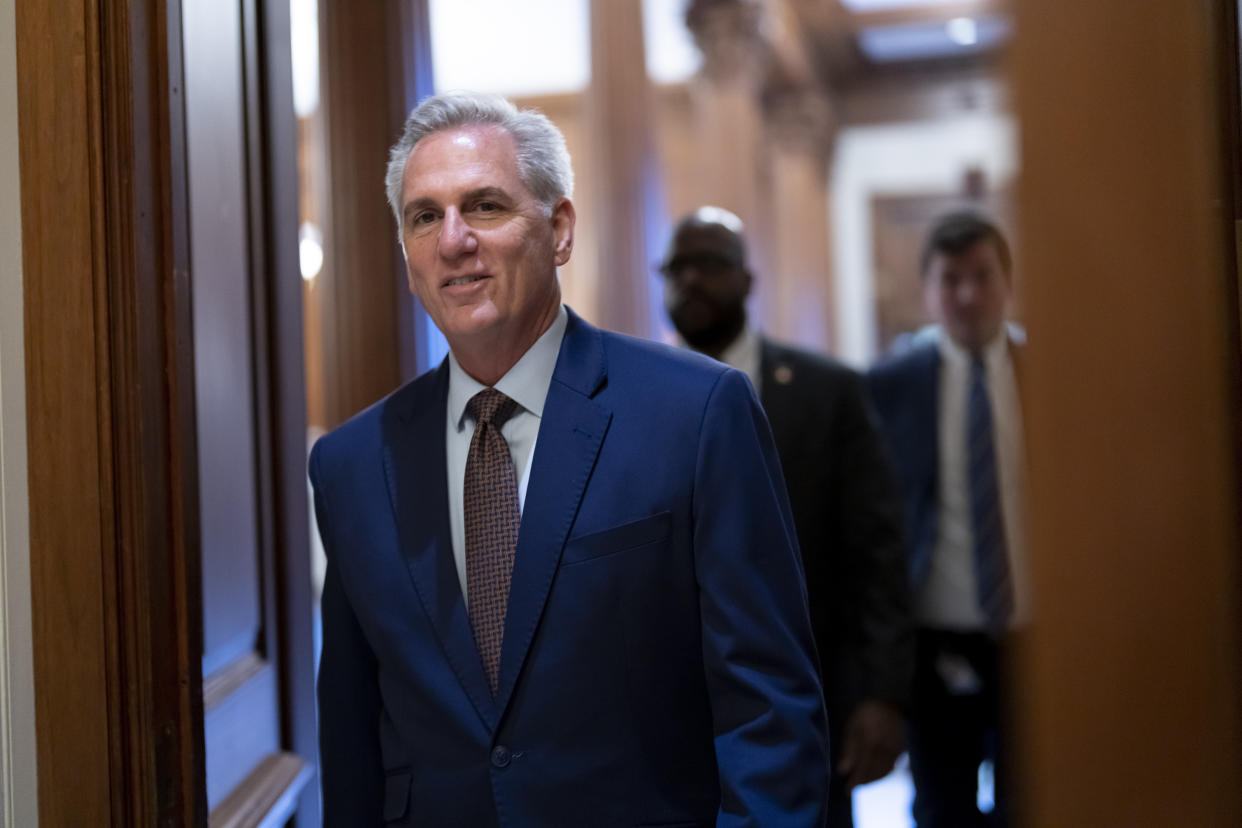 FILE - House Minority Leader Kevin McCarthy, R-Calif., walks to the chamber for final votes as the House wraps up its work for the week, at the Capitol in Washington, Friday, Dec. 2, 2022. Republicans face contentious leadership battles inside their new House majority and at the Republican National Committee. But former President Donald Trump will be central in virtually every conversation as the GOP enters what will likely be a nasty and crowded presidential primary that begins in earnest this spring. (AP Photo/J. Scott Applewhite, File)