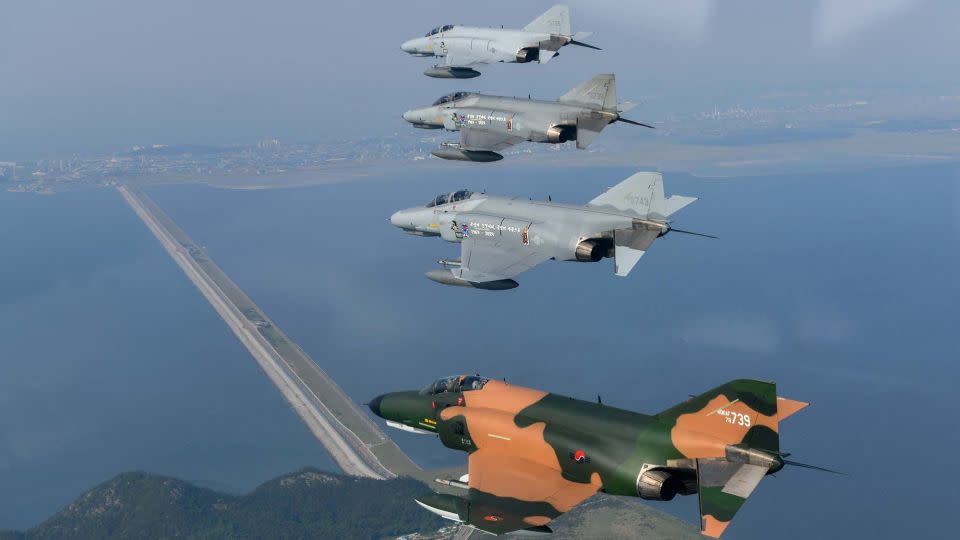 Four South Korean F-4 fighter jets fly in formation on May 8, 2024, during a commemorative final flight of the aircraft. - South Korean Air Force