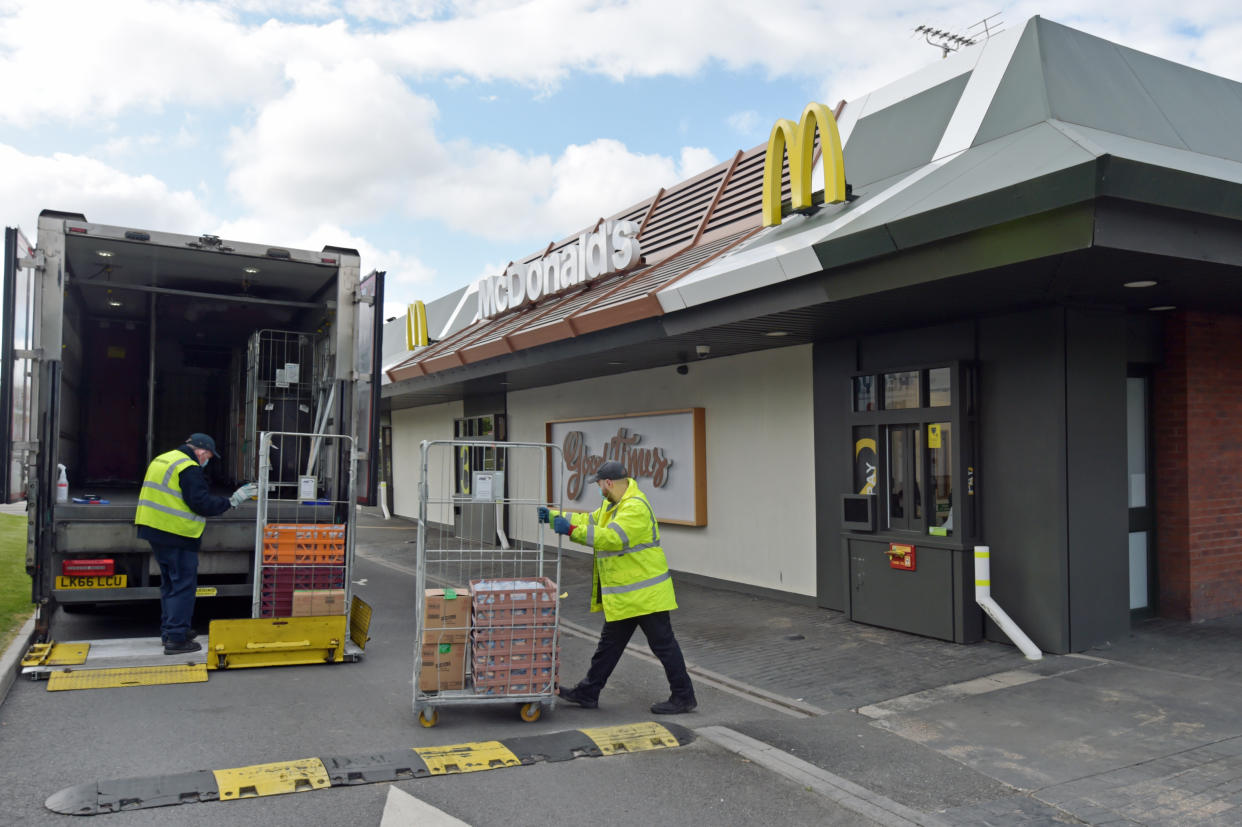 Staff members organise a delivery at a branch of McDonald's at Boreham, near Chelmsford in Essex, which one of 15 of the restaurant chain's locations which are reopening for delivery meals.