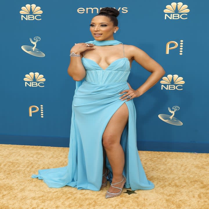 Robin Thede on the red carpet in a blue gown