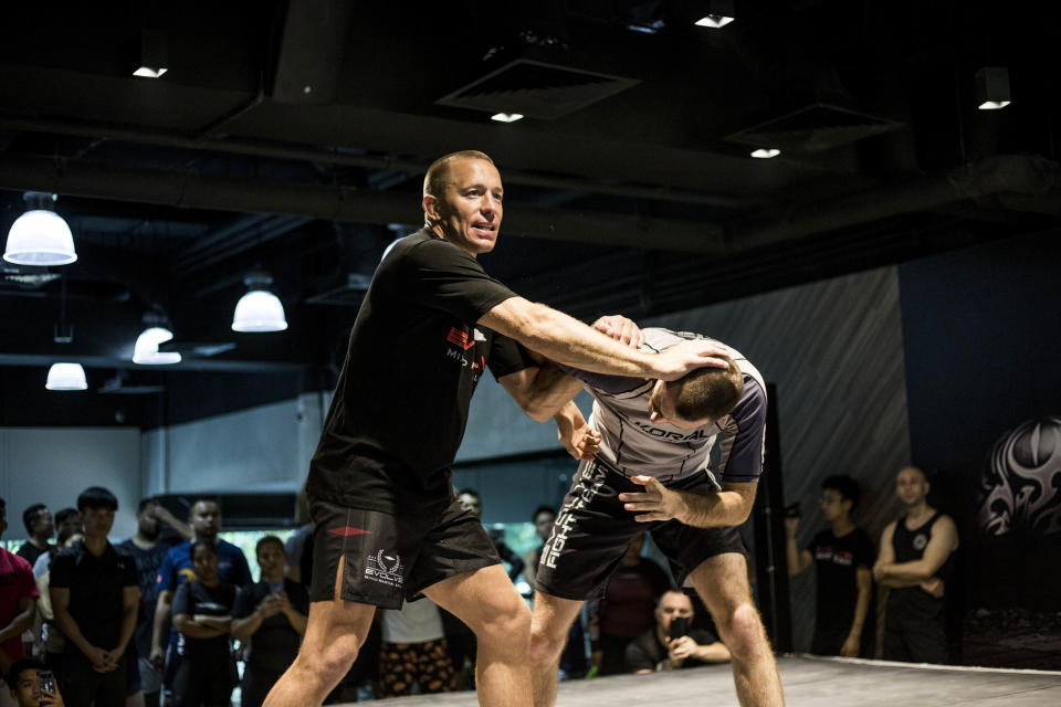 Retired mixed martial arts superstar Georges St-Pierre conducting an MMA seminar at the Evolve MMA Academy at Far East Square on 9 March 2019. (PHOTO: Evolve MMA)