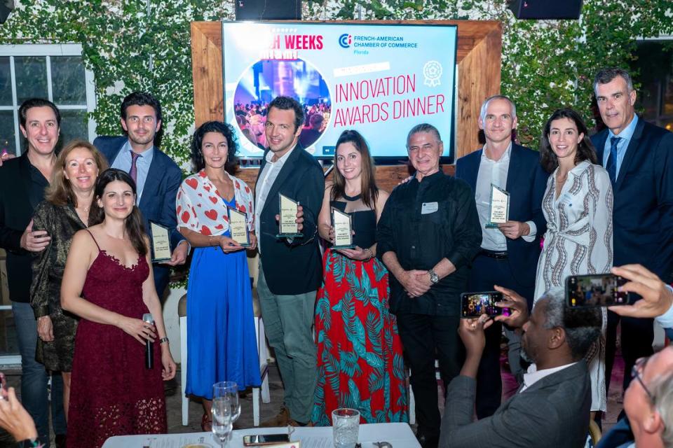 Winners of innovation awards and organizers of event. Loïc Ercolessi/For the Miami Herald