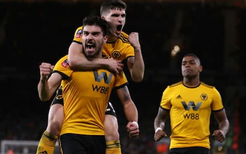 Wolverhampton Wanderers' Ruben Neves celebrates scoring his side's second goal of the game with Ruben Vinagre  - Credit: PA