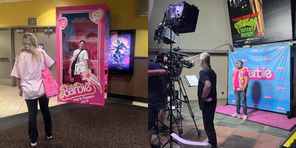 A woman takes a photo of another woman in an oversized Barbie doll box on the left while a man dressed in pink gives his opinion on the Barbie movie while standing on a pink carpet with a Barbie poster behind him.