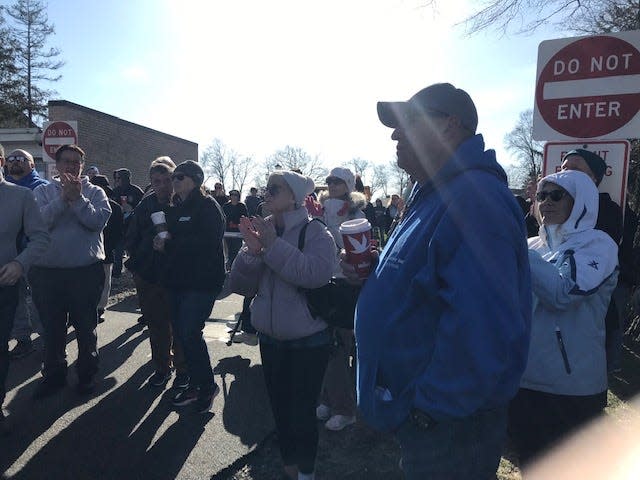 A crowd listens to speeches before the start of a march for the homeless in Toms River on Saturday.