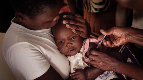 A child receives a shot during the launch of the extension of the worlds first malaria vaccine (RTS, S) pilot program for children at risk of malaria illness and death within Kenyas lake-endemic region at Kimogoi Dispensary in Gisambai, March 7, 2023. (Yasuyoshi Chiba/AFP via Getty Images)