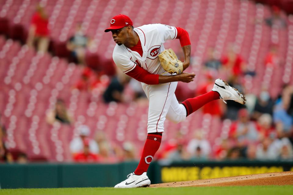 Cincinnati Reds starting pitcher Hunter Greene (21) throws a pitch in the first inning of the MLB National League game between the Cincinnati Reds and the Miami Marlins at Great American Ball Park in downtown Cincinnati on Tuesday, July 26, 2022.