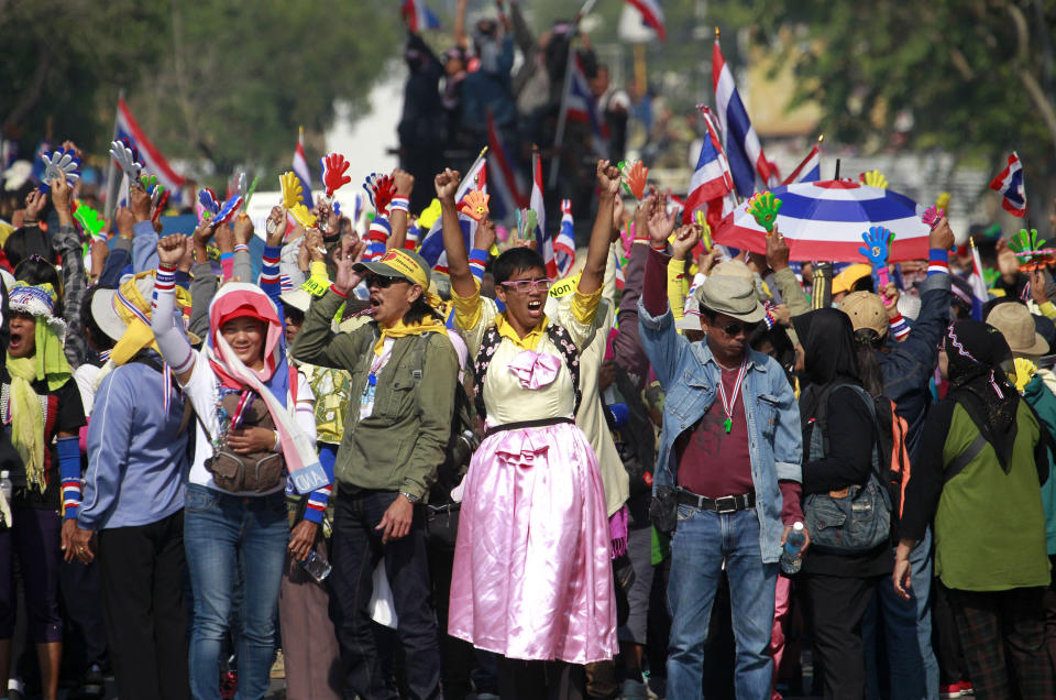 Anti-government protesters make their way on a street during a march Friday, Jan. 24, 2014 in Bangkok. Thailand’s Constitutional Court ruled Friday that nationwide elections scheduled for Feb. 2 can legally be delayed. (AP Photo/Wason Wanichakorn)