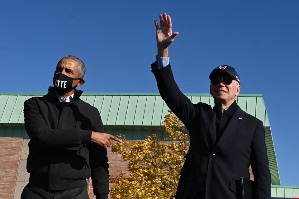 Former President Barack Obama joins Democratic presidential candidate Joe Biden at a campaign event in Flint on October 31, 2020.  / Credit: JIM WATSON/Getty Images