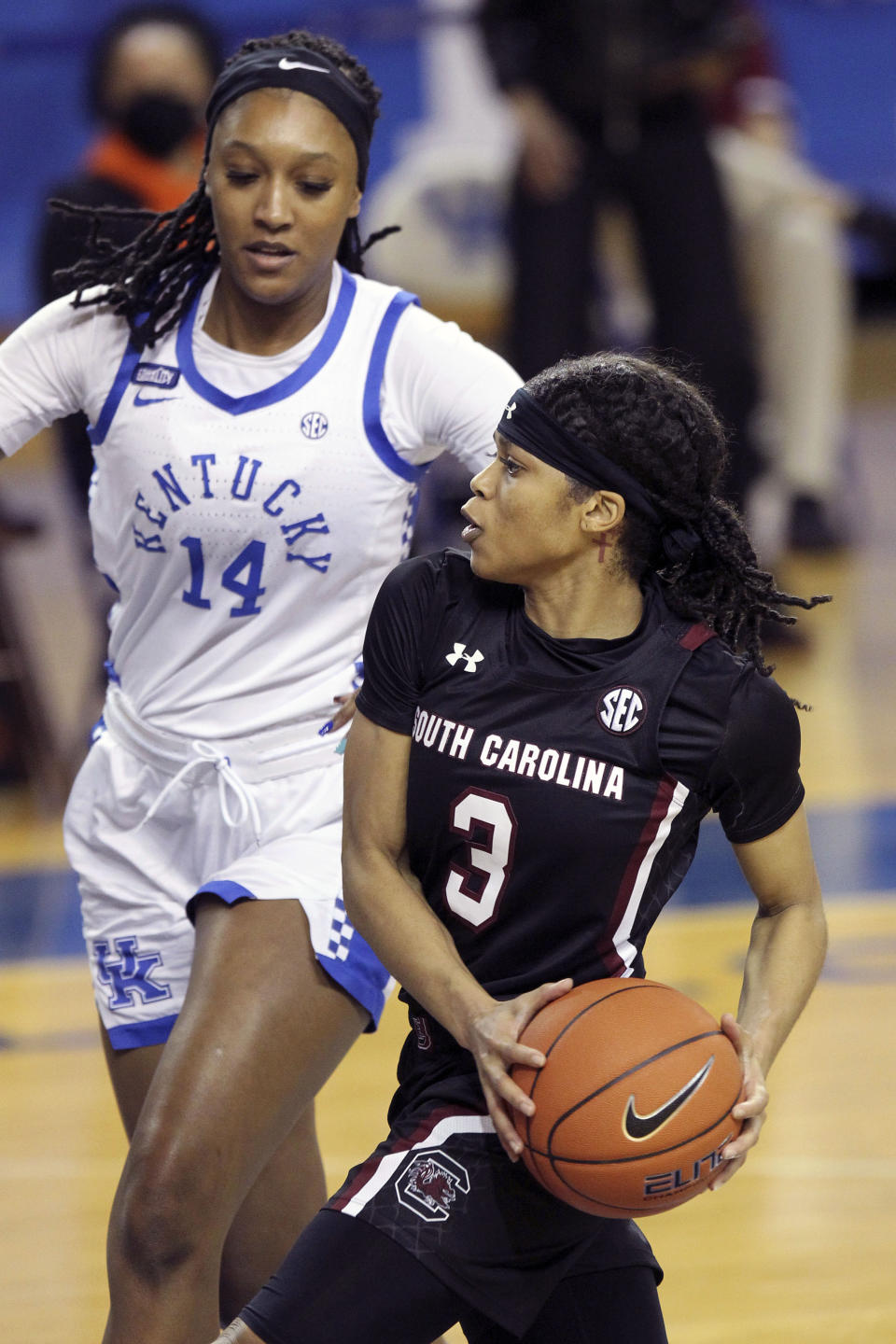 South Carolina's Destanni Henderson (3) drives near Kentucky's Tatyana Wyatt (14) during the second half of an NCAA college basketball game in Lexington, Ky., Sunday, Jan. 10, 2021. (AP Photo/James Crisp)