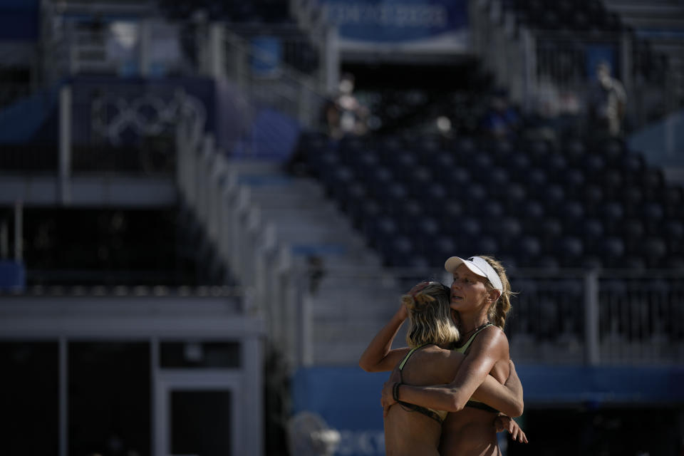 Margareta Kozuch, of Germany, right, and teammate Laura Ludwig react during a women's beach volleyball match against Switzerland at the 2020 Summer Olympics, Saturday, July 24, 2021, in Tokyo, Japan. (AP Photo/Felipe Dana)