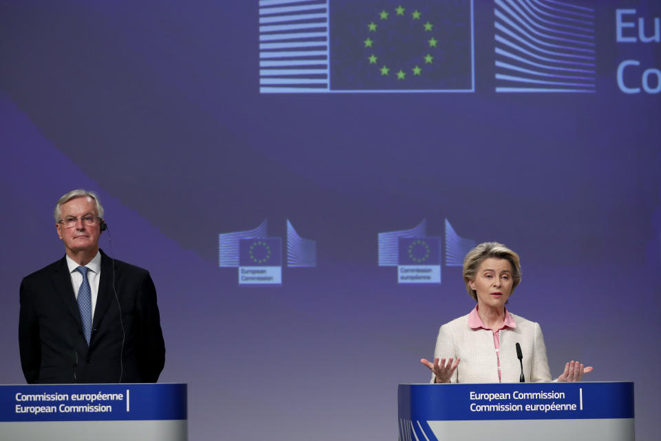 European Commission President Ursula von der Leyen, right, and European Commission's Head of Task Force for Relations with the United Kingdom Michel Barnier address a media conference on Brexit negotiations at EU headquarters in Brussels, Thursday, Dec. 24, 2020. (AP Photo/Francisco Seco, Pool)