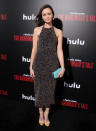 <p><em>The Handmaid’s Tale </em>star traded in her character Ofglen’s dowdy attire for a fun, confetti-like Cushnie et Ochs beaded frock at the premiere of the new Hulu series. Bright yellow sandals, a turquoise clutch, and flowing locks completed her carefree ensemble. (Photo: Getty Images) </p>