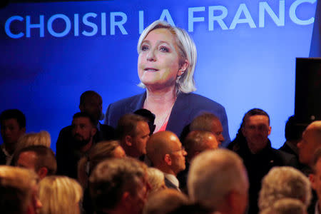 Marine Le Pen, French National Front (FN) political party candidate for French 2017 presidential election, is seen on a screen while conceding defeat at the Chalet du Lac in the Bois de Vincennes in Paris after the second round of 2017 French presidential election, France, May 7, 2017. REUTERS/Charles Platiau