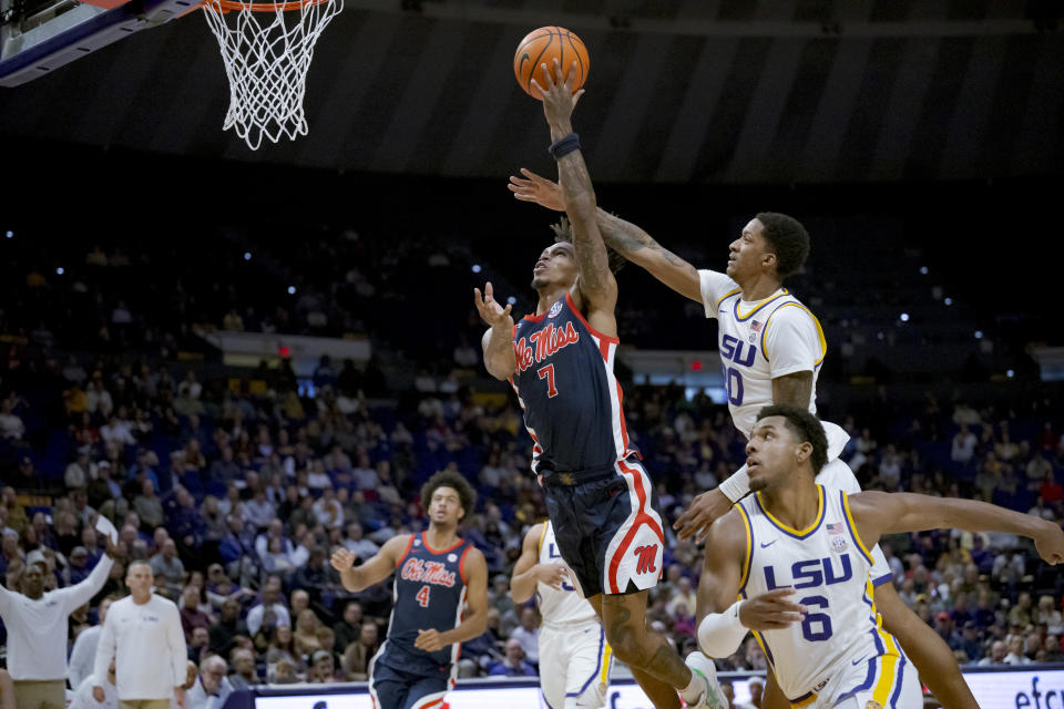 Mississippi guard Allen Flanigan (7) shoots against LSU forward Derek Fountain (20) during the first half of an NCAA college basketball game in Baton Rouge, La., Wednesday, Jan. 17, 2024. (AP Photo/Matthew Hinton)