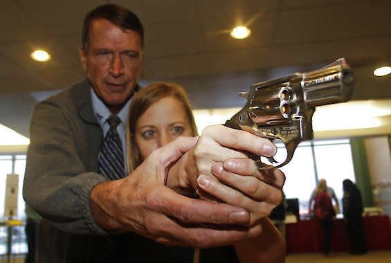 Cori Sorensen, a fourth-grade teacher from Highland Elementary School in Highland, Utah, receives firearms training with a .357 magnum Dec. 27, 2012, from personal defense instructor Jim McCarthy in West Valley City, Utah, where teachers and administrators are allowed to bring guns to school. Rick Bowmer | Associated Press