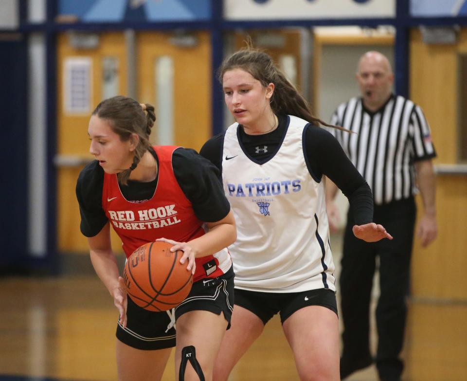 John Jay's Gabby Sweeney covers Red Hook's Emilie Kent during Thursday's scrimmage on November 30, 2023.