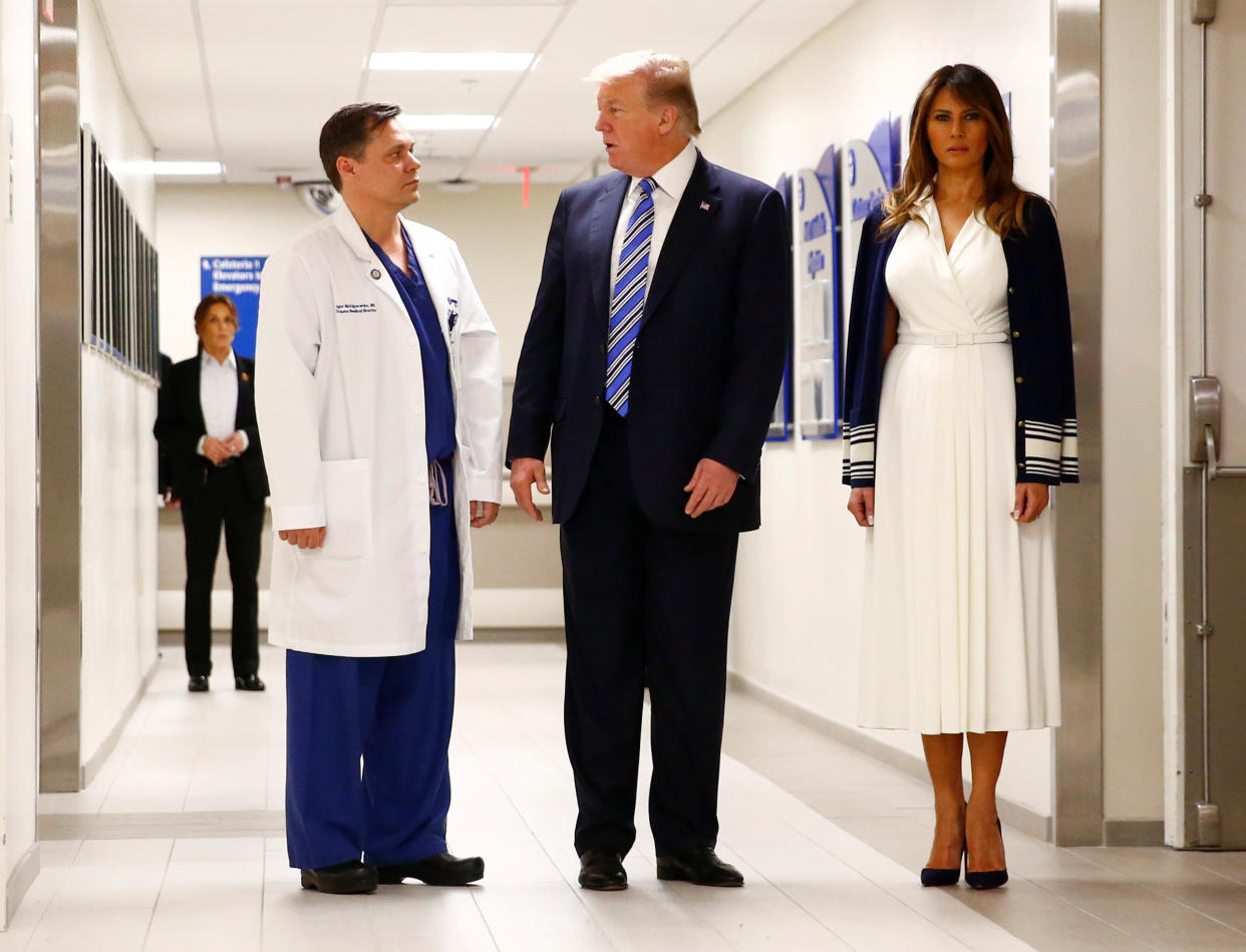 Donald and Melania Trump&nbsp;talk to Dr. Igor Nichiporenko a trauma surgeon at Broward Health North Hospital in the wake of the shooting at Marjory Stoneman Douglas High School that killed 17 people. Then it was off to&nbsp;the Mar-a-Lago disco party. (Photo: Reuters/Eric Thayer)