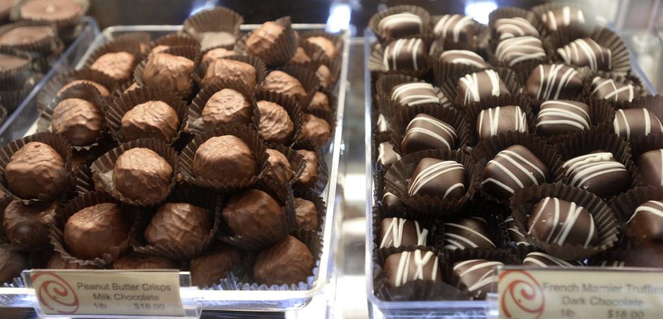 The Millcreek Mall location of Pulakos Chocolates displays shelves of locally made treats.