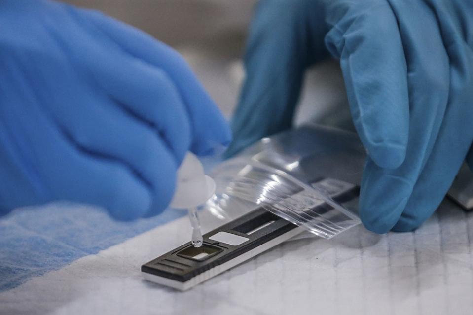 A health worker conducts a Covid-19 swab test at Dewan Seri Siantan in Selayang May 19, 2020. — Picture by Hari Anggara