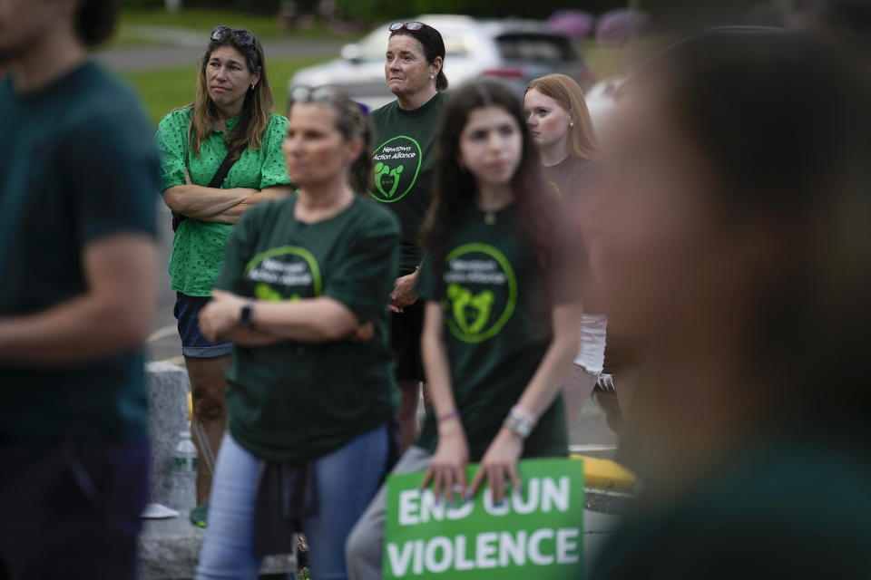 Local residents join survivors of the 2012 Sandy Hook Elementary School shooting for a rally against gun violence on Friday, June 7, 2024, in Newtown, Conn. (AP Photo/Bryan Woolston)