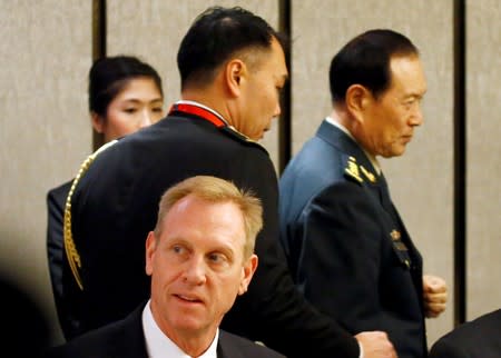 Chinese Defense Minister Wei Fenghe and Acting U.S. Defense Secretary Patrick Shanahan are seen at a ministerial roundtable at the IISS Shangri-la Dialogue in Singapore