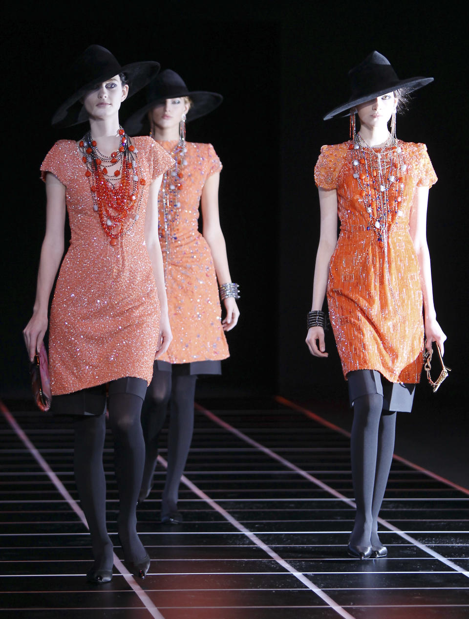 A model wears a creation part of the Giorgio Armani Women's Fall-Winter 2012-13 fashion collection, during the fashion week in Milan, Italy, Monday, Feb. 27, 2012. (AP Photo/Antonio Calanni)